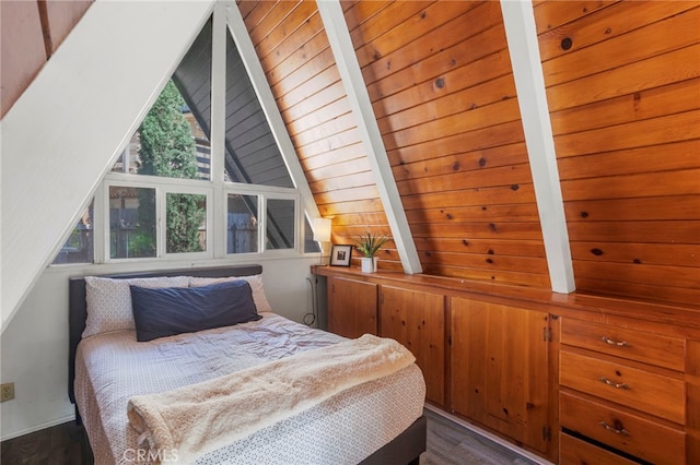 bedroom featuring vaulted ceiling with beams, wood walls, and dark hardwood / wood-style floors