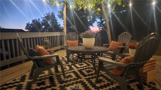 view of patio terrace at dusk