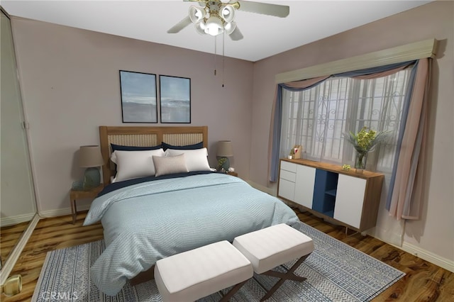 bedroom with dark wood-type flooring and ceiling fan