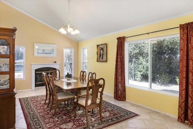 dining space featuring a notable chandelier, vaulted ceiling, light tile patterned floors, and a wealth of natural light