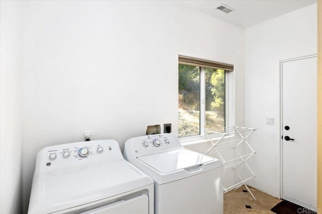 clothes washing area with carpet floors and washing machine and dryer