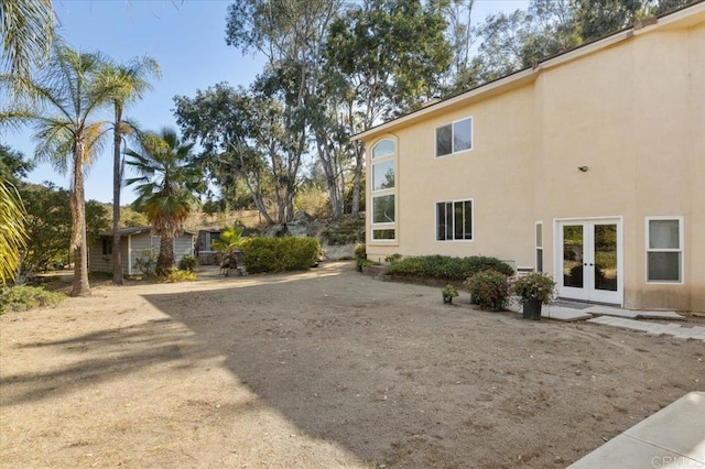 view of yard featuring french doors