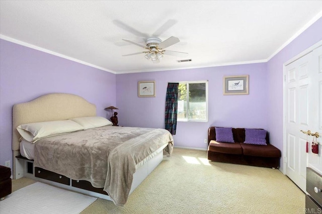 bedroom featuring carpet, ornamental molding, and ceiling fan