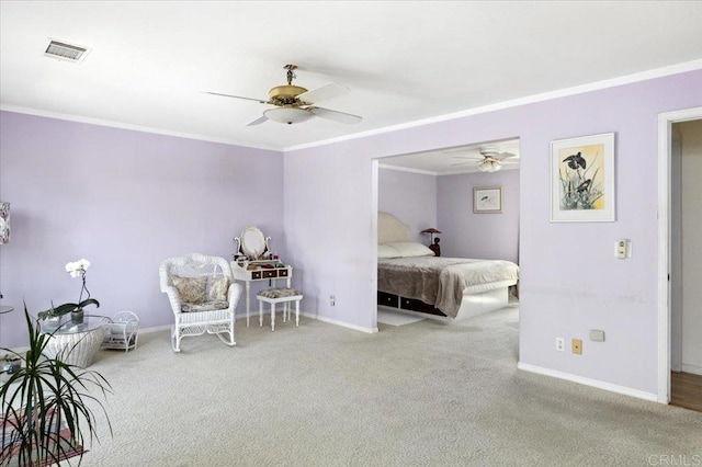 bedroom with ceiling fan, crown molding, and carpet