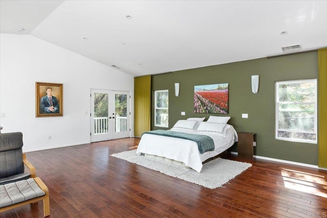 bedroom with lofted ceiling, multiple windows, access to outside, and dark hardwood / wood-style flooring