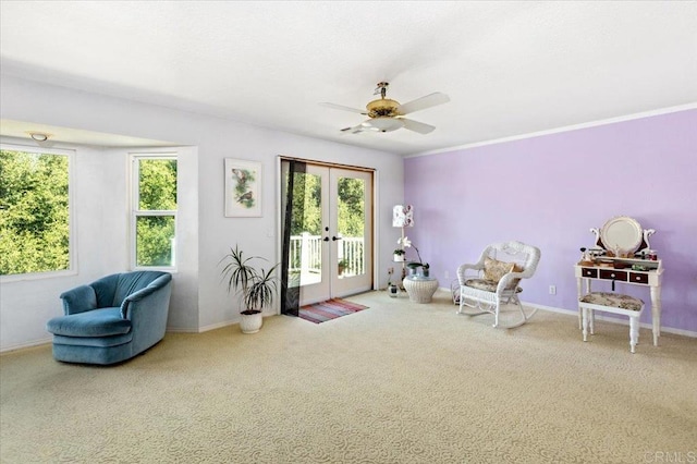 living area with ceiling fan, french doors, and carpet flooring