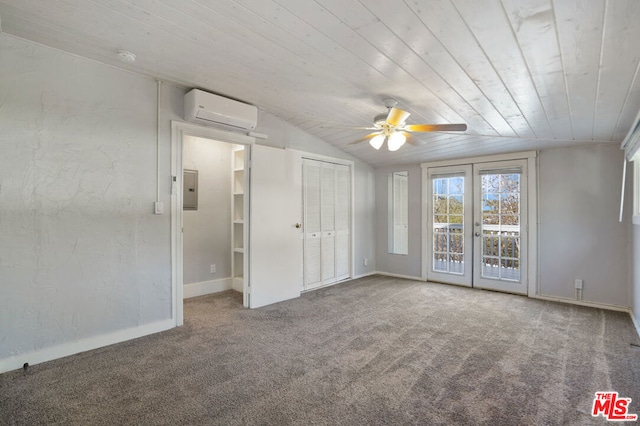 unfurnished bedroom featuring carpet flooring, lofted ceiling, a wall unit AC, and ceiling fan