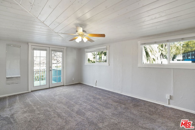 carpeted spare room with wood ceiling, lofted ceiling, ceiling fan, and french doors