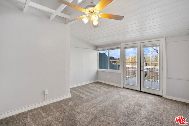 spare room featuring vaulted ceiling, ceiling fan, carpet floors, and french doors