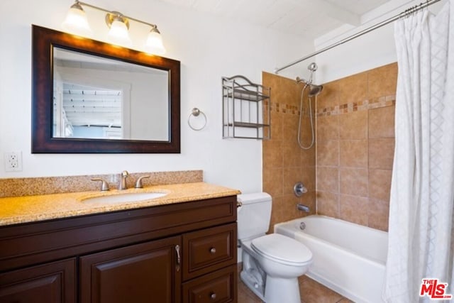 full bathroom featuring vanity, toilet, shower / bathtub combination with curtain, and tile patterned floors