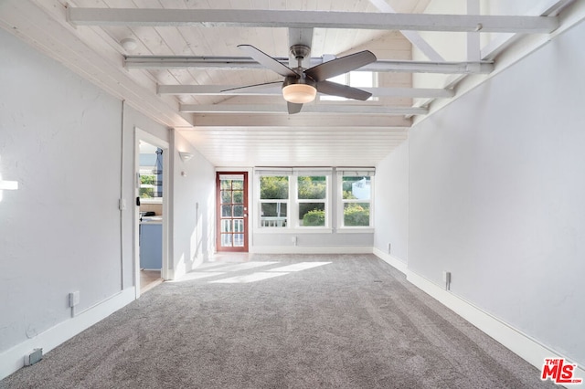 interior space featuring ceiling fan, beam ceiling, carpet, and wooden ceiling