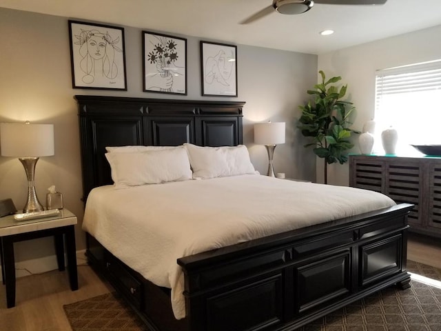 bedroom with ceiling fan and dark hardwood / wood-style flooring