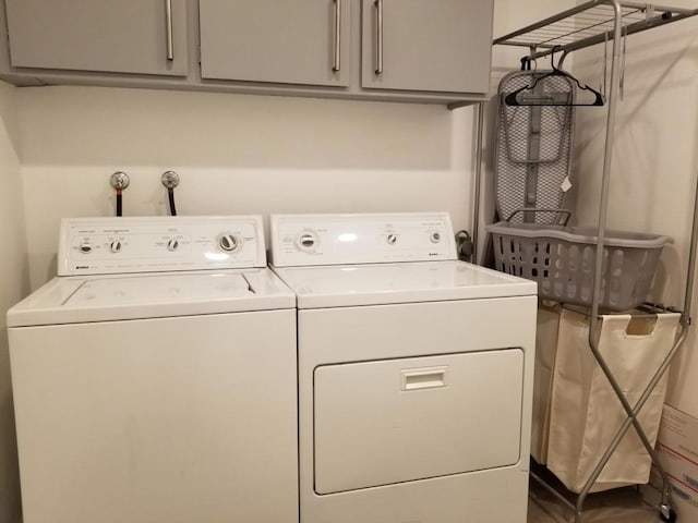 laundry area featuring cabinets and washer and dryer