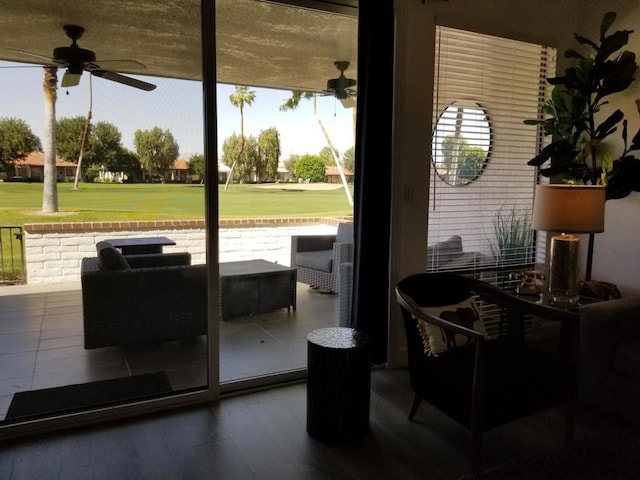 doorway to outside with ceiling fan