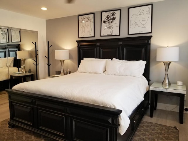 bedroom with dark wood-type flooring