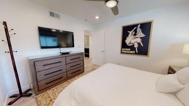 bedroom with ceiling fan and light hardwood / wood-style flooring