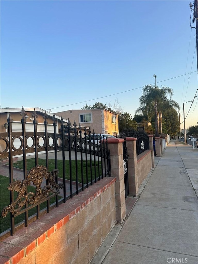 view of gate at dusk