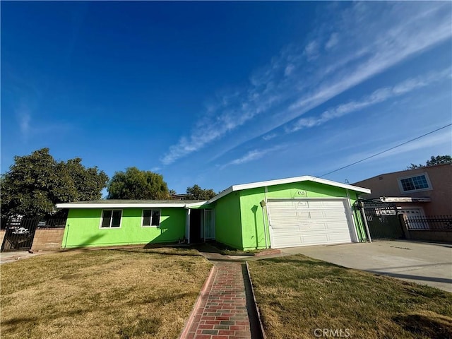 ranch-style home featuring a garage and a front yard