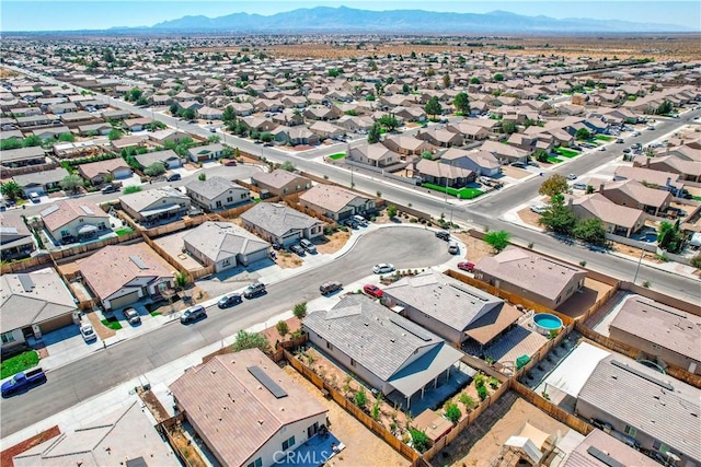 birds eye view of property featuring a mountain view