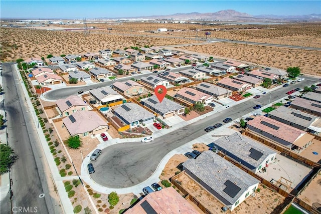 drone / aerial view featuring a mountain view