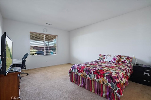 bedroom with light carpet