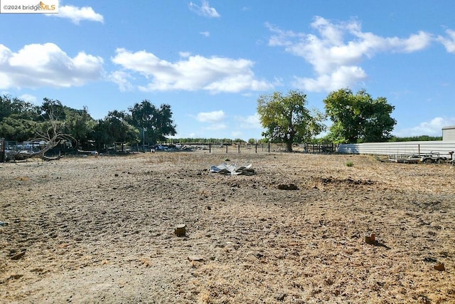 view of yard with a rural view