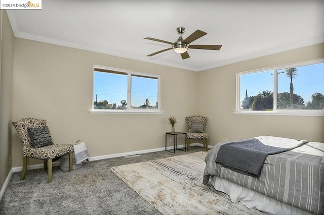 bedroom featuring carpet, crown molding, and ceiling fan