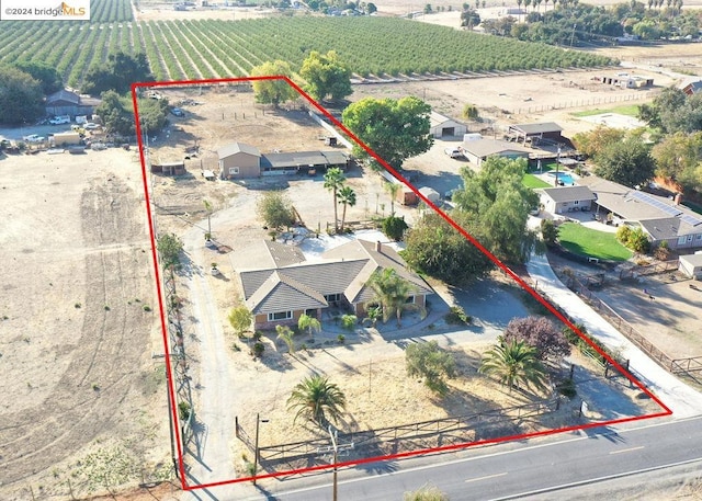 birds eye view of property featuring a rural view