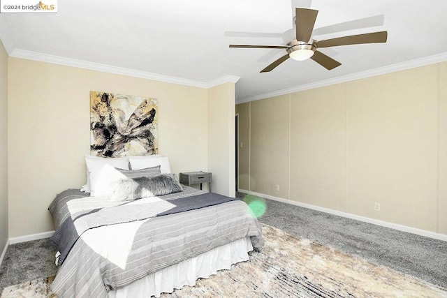 bedroom featuring ceiling fan, ornamental molding, and carpet