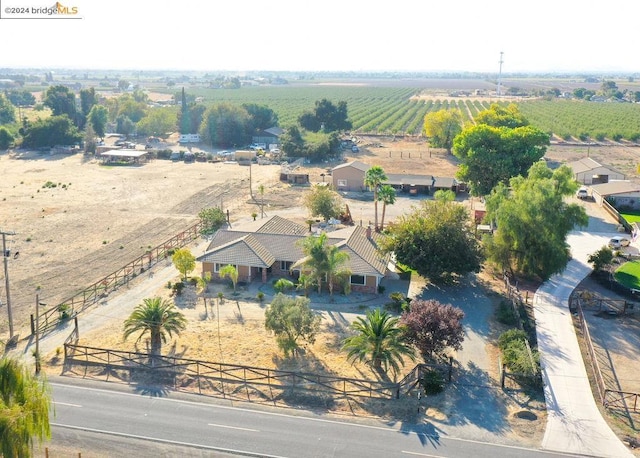 birds eye view of property with a rural view