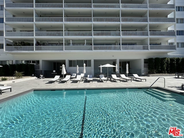 view of pool featuring a patio area