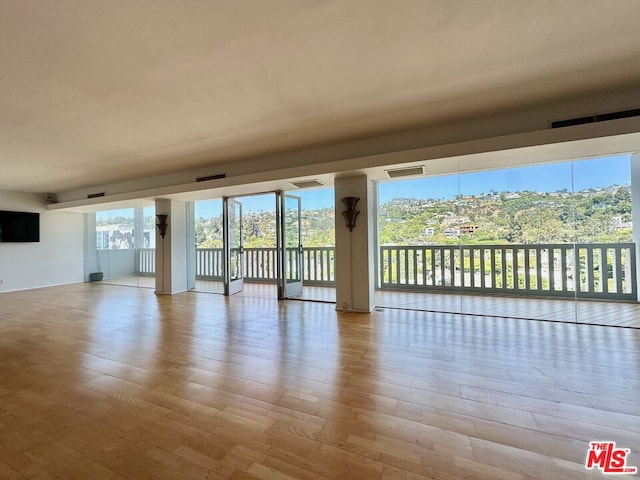 spare room featuring light hardwood / wood-style floors