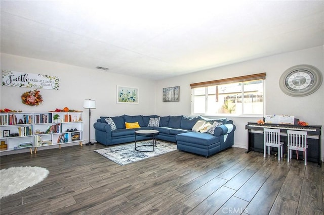 living room featuring dark wood-type flooring