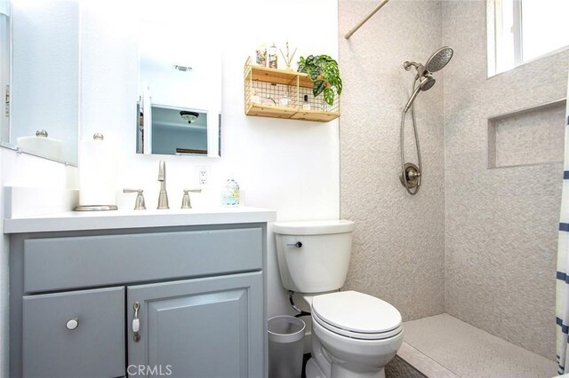 bathroom with vanity, a shower with curtain, and toilet