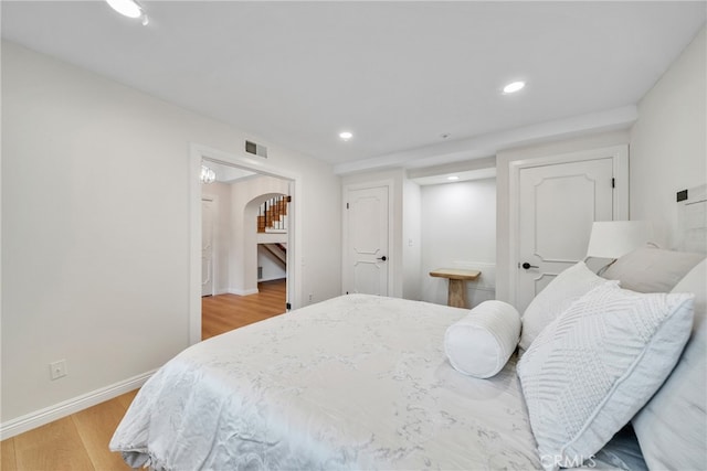 bedroom with light hardwood / wood-style floors