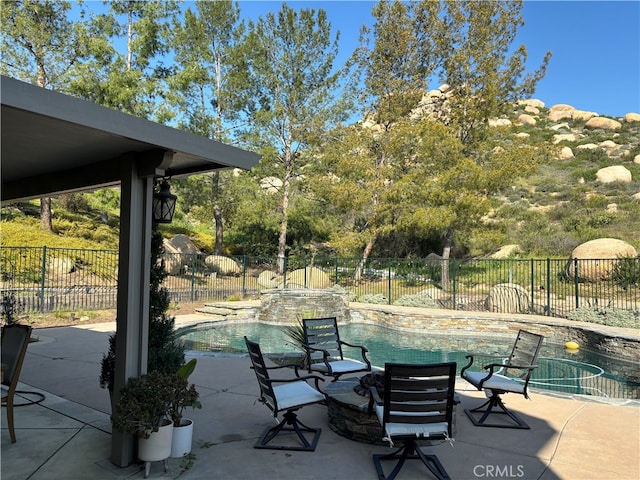 view of patio with a fenced in pool