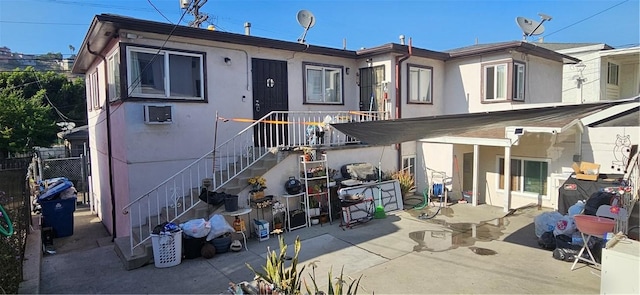 rear view of house featuring a patio