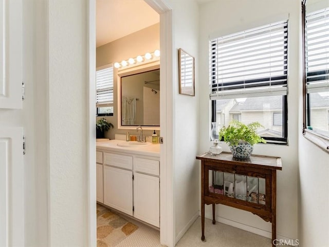 bathroom featuring vanity and baseboards