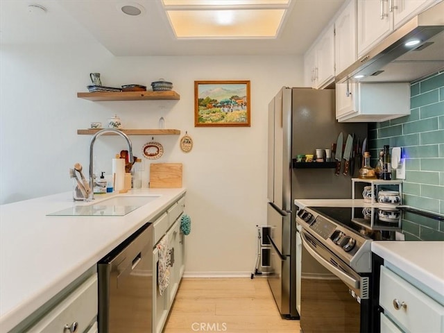 kitchen featuring under cabinet range hood, electric range, a sink, light countertops, and dishwasher