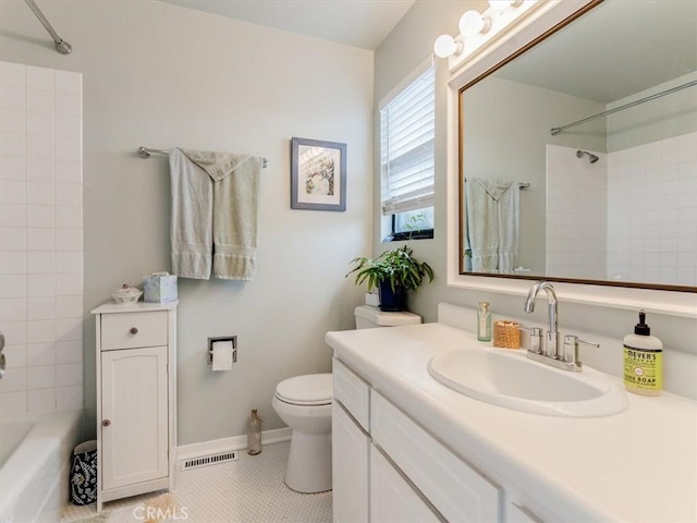 bathroom with baseboards, visible vents, toilet, vanity, and shower / bathing tub combination