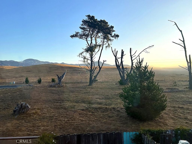 yard at dusk with a mountain view