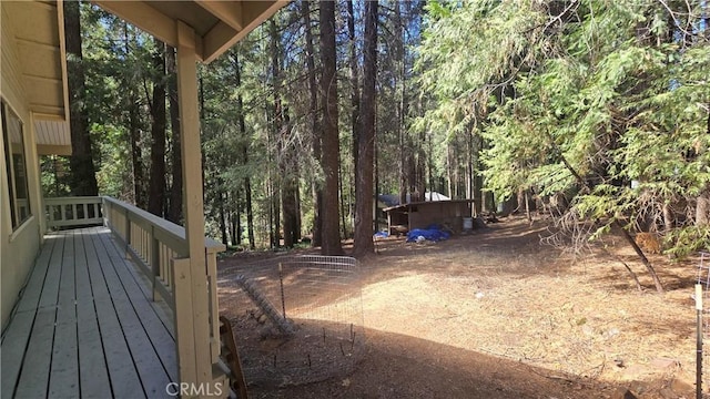 view of yard featuring a wooded view