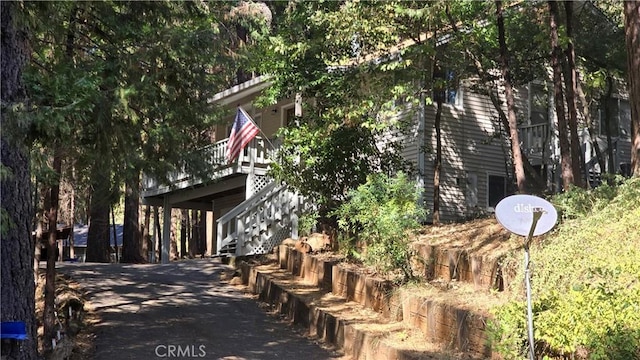 view of side of home with stairway