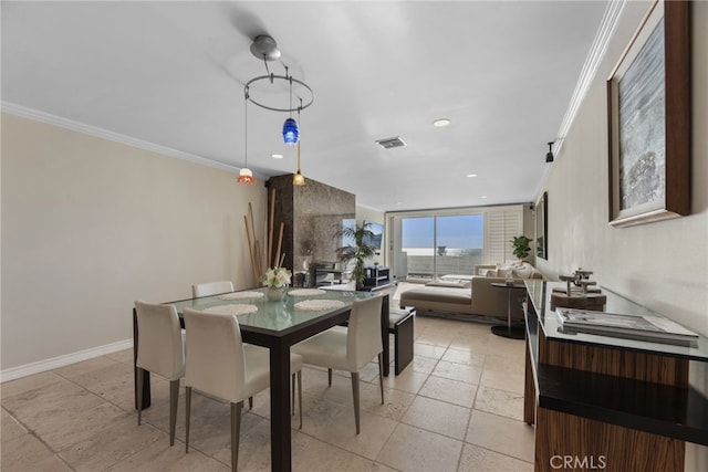 dining area with crown molding