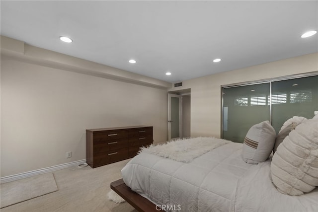 bedroom with light colored carpet