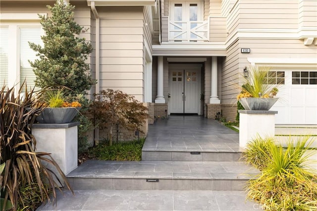 entrance to property featuring a garage