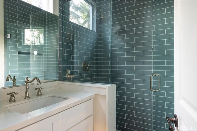 bathroom with vanity and walk in shower