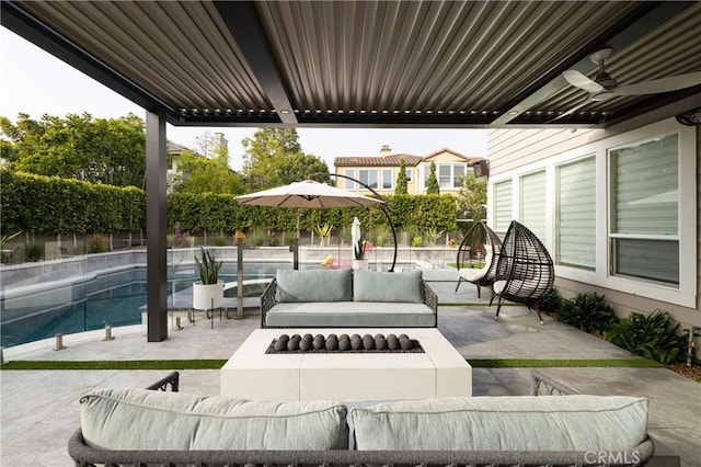 view of patio / terrace with an outdoor fire pit and ceiling fan