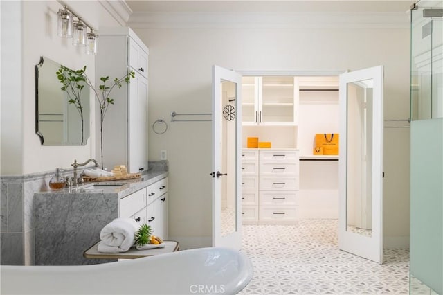 bathroom with vanity and ornamental molding