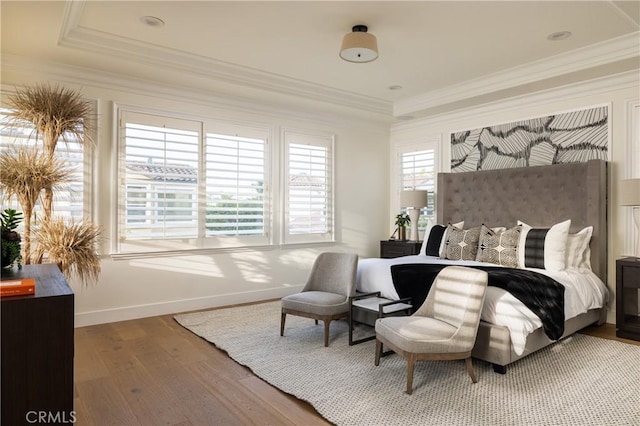 bedroom featuring crown molding and hardwood / wood-style flooring